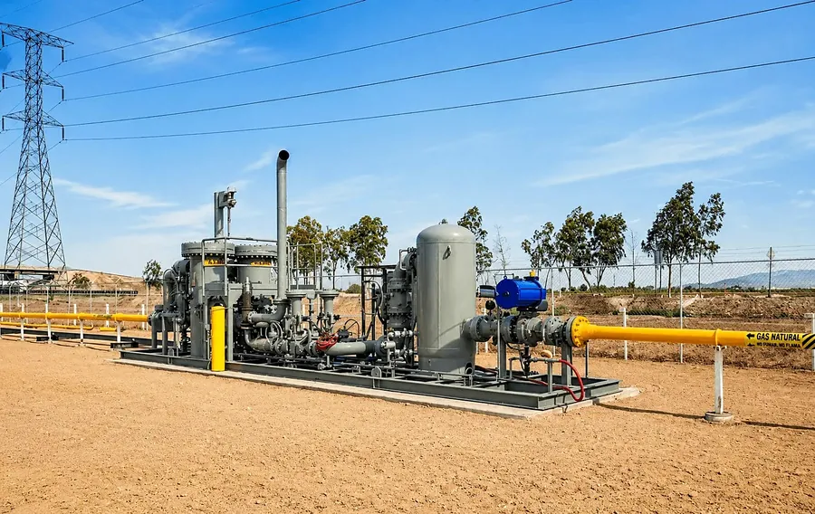 Fuel gas conditioning skid installed at a power site beside transmission lines