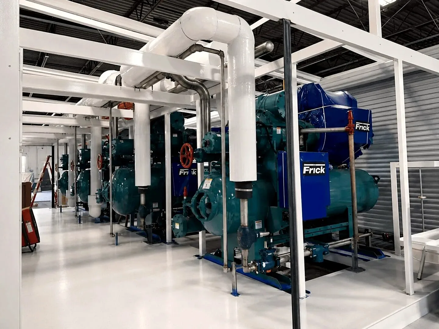 Integrated balance-of-plant module with compressors and insulated piping