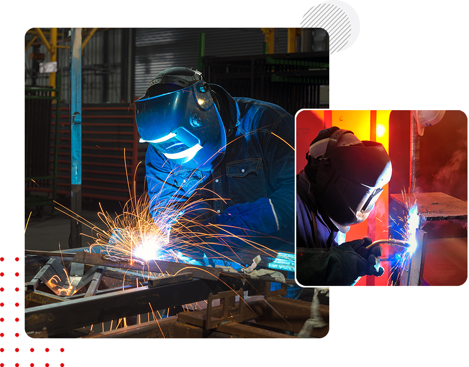 A man welding in the middle of a factory.