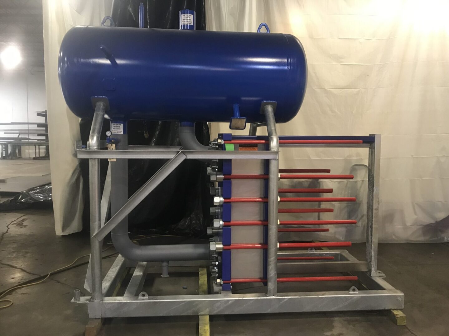 A blue tank sitting on top of a metal rack.