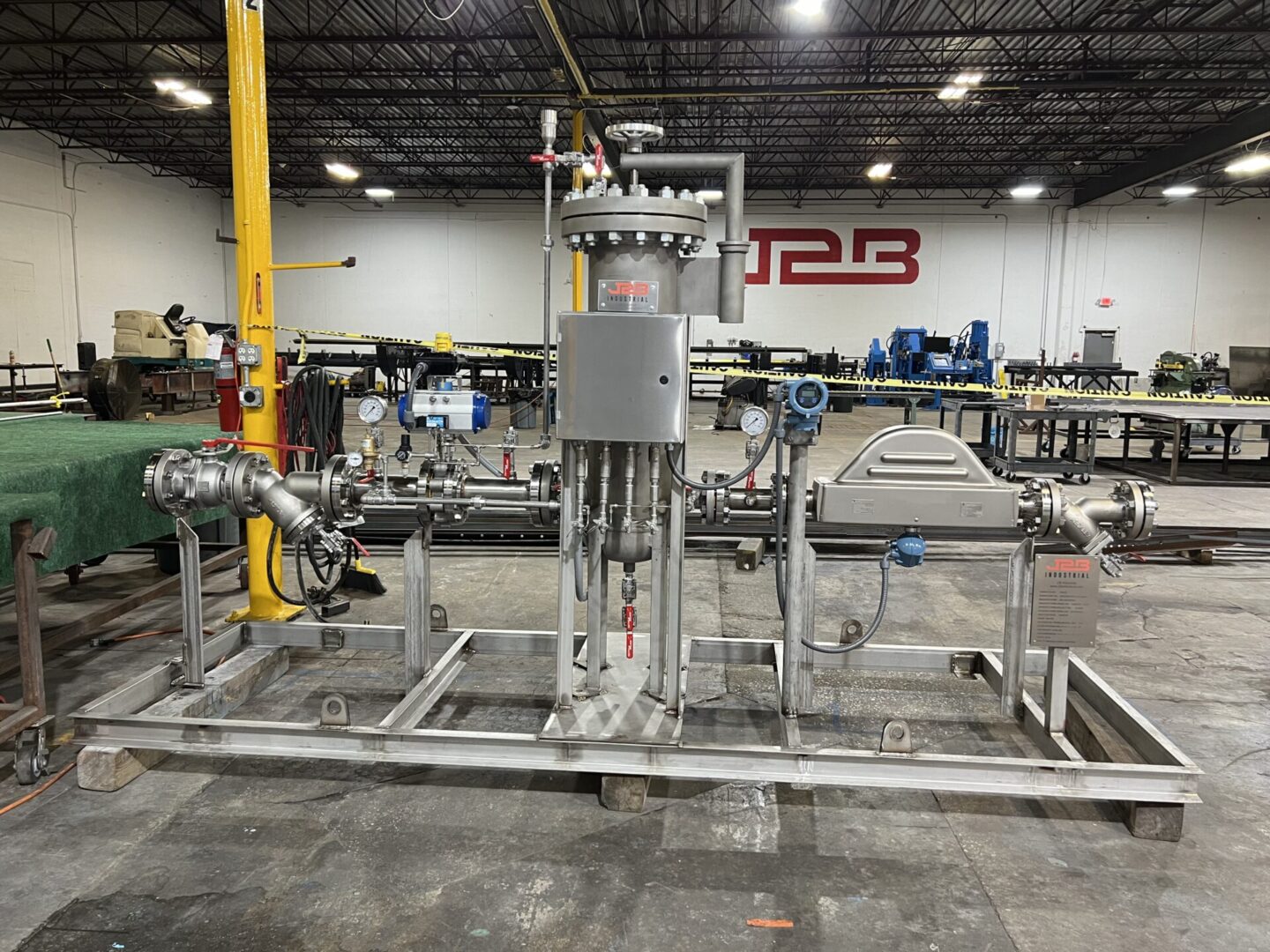 A large metal machine in a factory setting.