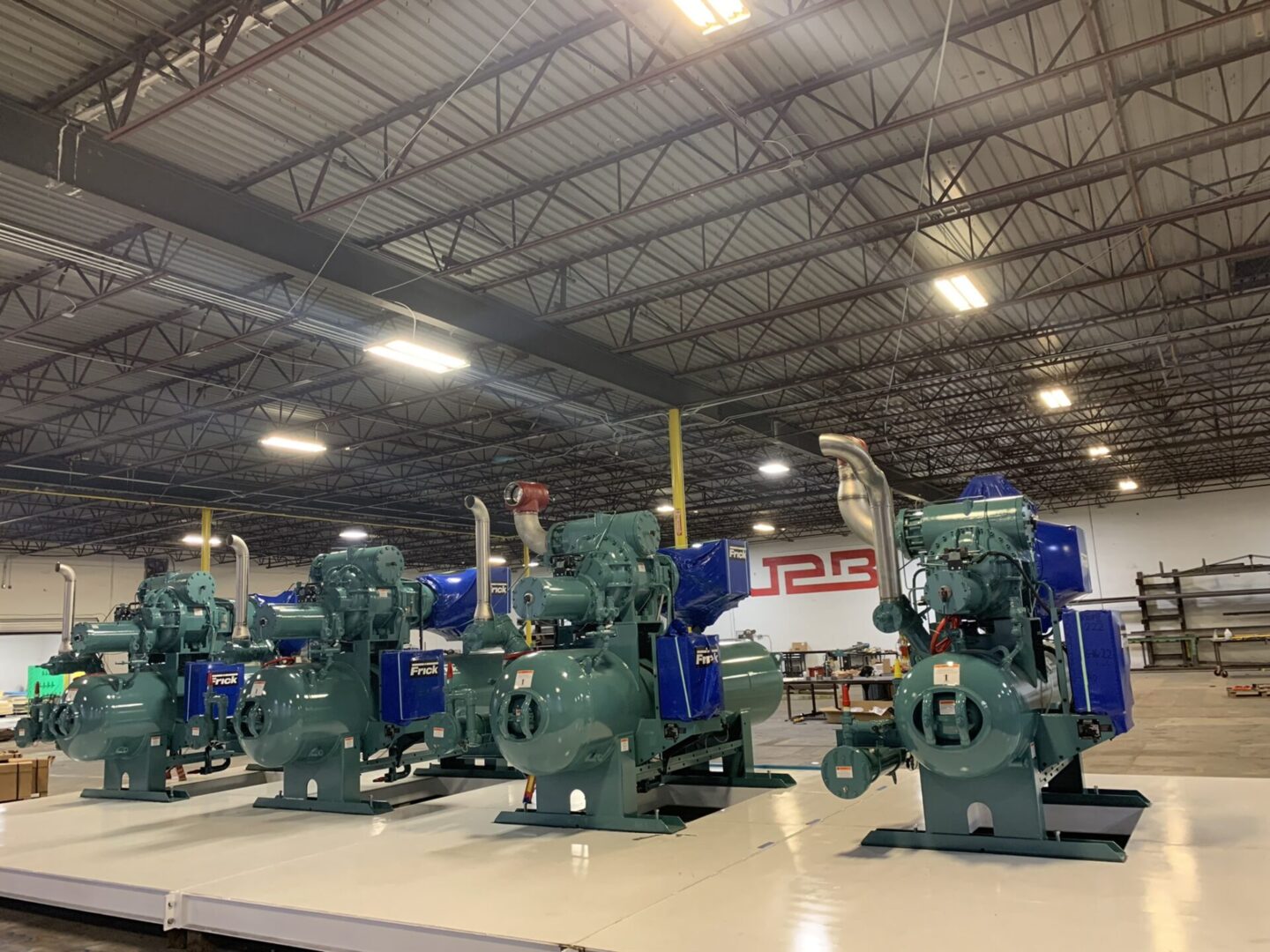 A group of engines sitting on top of tables.