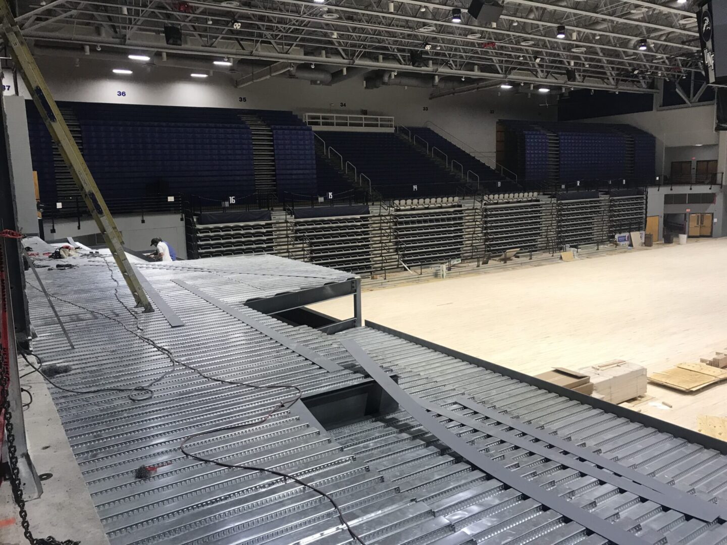 A large metal structure in an indoor arena.