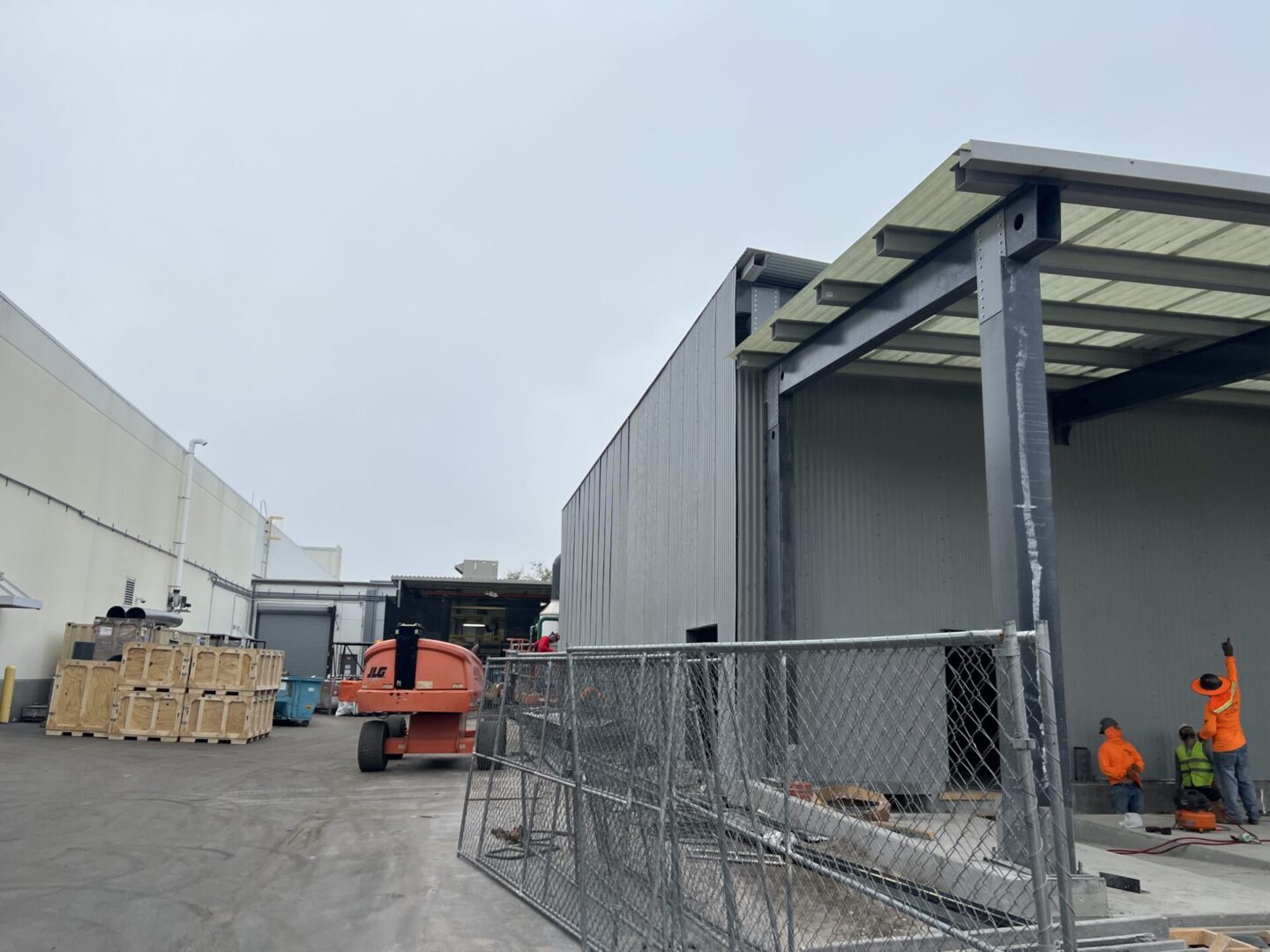 A large truck parked in front of a building.