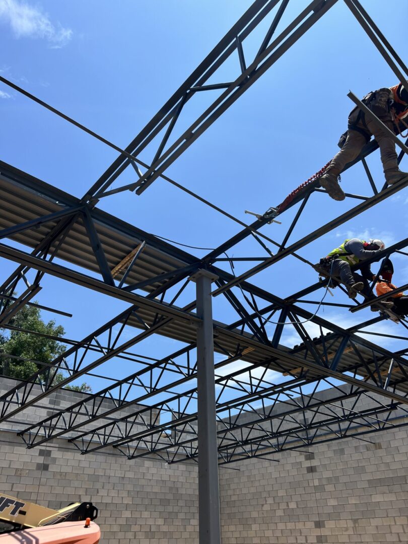 A group of people working on the roof of a building.